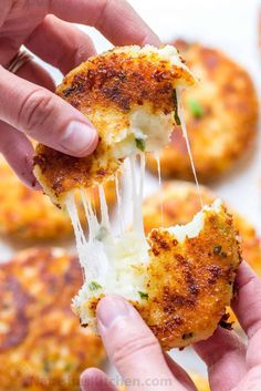 Cheesy Mashed Potato Pancakes Recipe (VIDEO) - NatashasKitchen.com Claim Jumper Potato Cakes, Cheesy Stuffed Potato Cakes, Cheesy Potato Cakes, Green Chili Cheese Potato Cakes, Midwest Dinner Recipes, Cheese Stuffed Potato Cakes, Cheesy Beef Stuffed Potato Cakes, Idaho Potato Recipes, Stuffed Potato Cakes