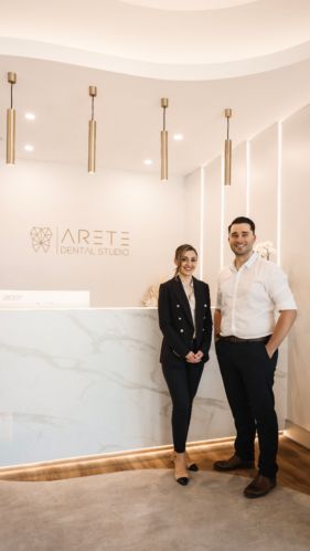 Arete Dental - Consilo Dental Reception Design, Luxury Dental Clinic, Aesthetic Clinic Interior, Dental Office Design Receptions, Dental Reception, Warm Paint Colors, Clinic Interior, Walnut Timber, Timber Slats