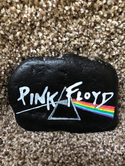 Pink Floyd Painted Rock | Etsy Rock Band Painted Rocks, Outlet Covers Painting, Funny Rocks, Pink Floyd Art, Painted River Rocks, Funny Rock, 1 March, Diy Rock Art, New Zealand Art