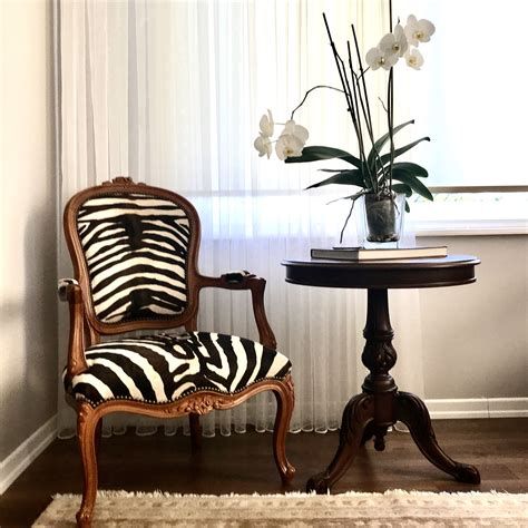 Zebra Chairs In Living Room, Zebra Print Chair, Zebra Dining Room Chairs, Ideas For 50th Birthday Party, Zebra Dining Room, Bergere Chair Living Room, Ideas For 50th Birthday, Zebra Living Room, 50th Birthday Party Decor