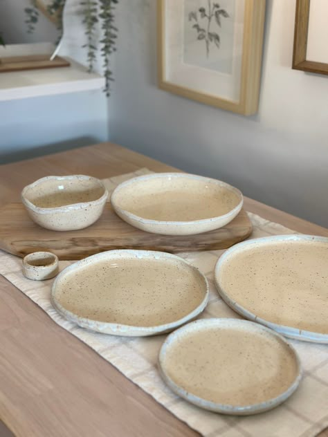 Made-to-Order Speckled Stoneware Pottery Dinnerware Set Processing Time: 2 to 3 weeks Introducing my latest handmade dinnerware set! These plates feature a rustic, speckled design with a soft, natural beige finish. The edges have an organic, uneven texture, adding a unique, handcrafted charm to each piece. The set includes three different sizes, perfect for any meal from appetizers to main courses. Each piece is carefully crafted to ensure uniqueness and quality, making your dining experience special. The price listed is for one set, which includes, - dinner plate (10.5") - dessert plate (8.5") - appetizer plate (6.5")  - small bowl (5.5") - large bowl (8.5") - napkin ring (2") These plates are food safe, dishwasher safe, oven safe, and microwave safe. They are fired at a high temperature Stoneware Plates Dinnerware Sets, Organic Plates Ceramic, Handmade Dishes Pottery, Rustic Ceramic Plates, Unique Plates Dinnerware, Ceramic Plate Handmade, Handmade Dinnerware Set, Beginner Handbuilding Pottery, Rustic Dishware