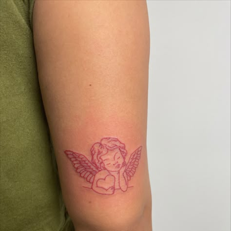 Cherub Tattoo Cherub Rib Tattoo, Red Ink Angel Tattoo, Angel Cupid Tattoo, Cinnamon Girl Tattoo, Red Angel Tattoo, Cherub Angel Tattoo, Cherub Tattoo Designs, Ny Tattoo, Baby Angel Tattoo