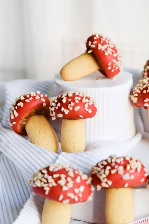 Strawberry almond mushroom cookies - chocolate cookies with a mushroom cap that is filled with almonds and jam. The red color will bring life to your cookie plate and holiday table. These hold well for at least a week! | mitzyathome.com Mushroom Shaped Cookies, Mushroom Cookies, Strawberry Almond, Vanilla Cookies, Idul Fitri, Chocolate Almonds, Tea Cakes, Holiday Cookies, Christmas Baking