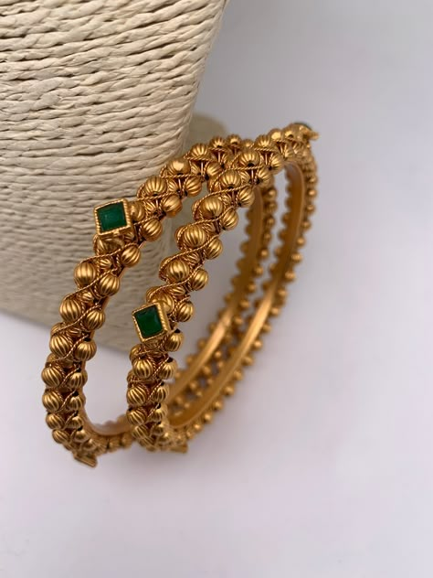 Green Stone Golden Bangles--Traditional Bangles comes as a pairColor : GoldenStones : Green Stone.#jewelrylover #handcraftedjewelry #jewelryinspiration #jewelrydesign #jewelryobsessed #jewelryoftheday #jewelrygoals #jewelryfashion #jewelrytrends Golden Bangles Indian Design, Green Stone Necklace Indian, Bangles Gold Design, Gold And Green Jewelry, Antique Gold Bangles Design, Green Stone Bangles, Bangles Jewelry Designs Gold, Gold Kangan, African Bangles