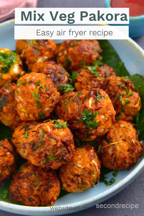 Discover the secret to creating scrumptious vegan and gluten-free Air Fryer Mix Veg Pakoras that will delight your taste buds. Our easy-to-follow recipe will have you mastering the art of mixed veg fritters in no time. Say goodbye to heavy, greasy fried food and hello to a healthier, tastier alternative! Follow us @secondrecipe for more interesting recipes. Veggie Party Food, Veg Pakora Recipe, Crispy Cabbage, Air Fryer Recipes Indian, Vegetable Pakora, Mix Veg, Mix Vegetable, Lentil Flour, Pakora Recipes