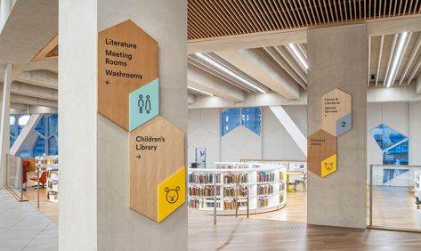 Exploration and Whimsy at Calgary Central Library | Entro Communications Library Wayfinding Signage, Library Signage Ideas, Library Wayfinding, Donor Signage, Directory Signs, Library Signage, School Graphics, Signage Acrylic, Children's Library