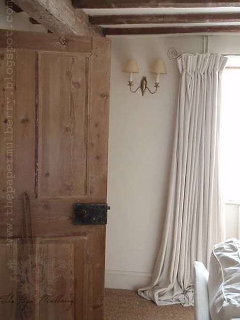 the sitting room ceiling beams are oak and thought perhaps to predate the house maybe coming from the nearby demolished Norman castle stables - the doors are of various dates throughout the house with this one (in pine) perhaps dating from the Victorian period with a later Bakelite handle - - photography Glenda Steel The Paper Mulberry Castle Stables, Norman Castle, Paper Mulberry, Country Interiors, Curtain Styles, Wooden Doors Interior, Victorian Period, Cottage Interiors, Cotton Curtains