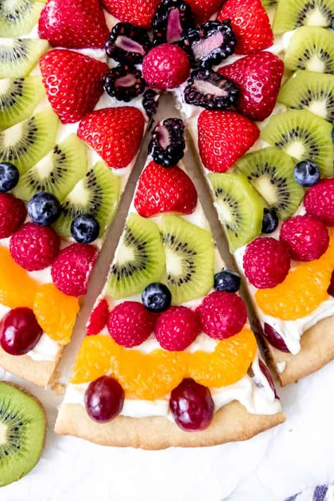 Soft sugar cookie with just a hint of lemon meets tangy cream cheese fruit dip and all the fresh fruit you can pile up in this Fruit Pizza recipe that is quick, easy to make, and is a guaranteed crowd pleaser. It's got the wow factor of a French Fruit Tart, but without the intimidation of making a tart crust and pastry cream filling! #fruit #pizza #dessert #recipe #easy Fresh Fruit Pizza, Pizza Fruit, Soft Sugar Cookie, Cream Cheese Fruit Dip, Easy Fruit Pizza, Fruit Pizza Recipe, Southern Kitchen, Soft Sugar, Soft Sugar Cookies