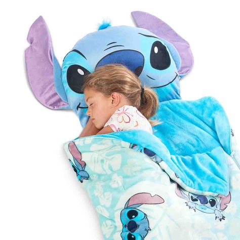 Stitch “Palm Smiles” Slumber Bag With Pillow                                                    Highlights Slumberbag with pillow Soft and warm Licensed Convenient for on the go 100% polyester Size: 55"L x 28"W x 4"H 4.1 lbs.                                                                About this item Introducing the Stitch "Palm Smiles" Slumber Bag With Pillow, a must-have for all your little ones' sleepover adventures! This super soft and vibrantly colored slumber bag is perfect for creating Lilo And Stitch Toys, Bed On The Floor, Lilo And Stitch Characters, Lilo And Stitch Merchandise, Stitch Backpack, Lilo And Stitch Drawings, Stitch Toy, Kids Room Interior Design, Stitch Character