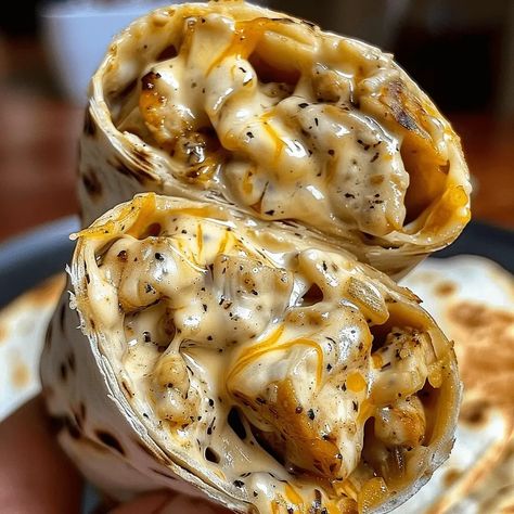 Cheesy Garlic Chicken Wraps: A Deliciously Easy Meal - MmmRecipes : Easy and Delicious Recipes Cheesy Garlic Chicken, Chicken Wrap Recipes, Creamy Garlic Sauce, Chicken Wrap, Chicken Wraps, Wrap Recipes, Garlic Chicken, Flavorful Recipes, Onion Powder