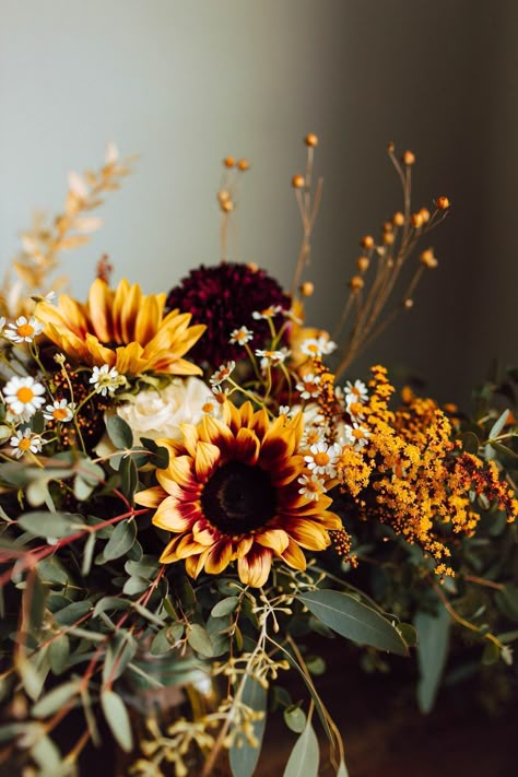 These mini sunflowers were so sweet for this intimate fall backyard wedding day! The warm tones mixed with fresh greenery created a natural and romantic style. For more backyard wedding inspiration, check out our blog! Small Intimate Fall Wedding, Mums And Sunflower Wedding, Wedding Decor With Sunflowers, Fall Wedding Greenery, Fall Sunflower Bouquet, Fall Flower Wedding, Small Fall Wedding, Plum Sunflower, Sunflower Fall Wedding