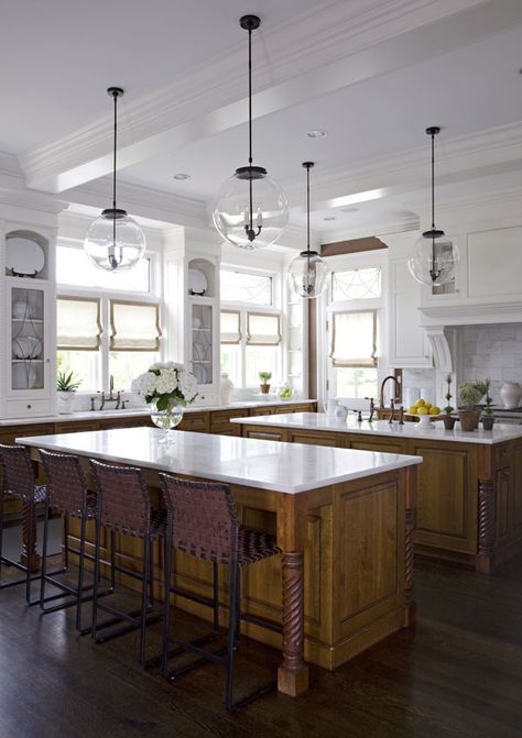 Kitchen Design by S.B. Long Interiors, Photo Credit: Don Freeman // kitchen // traditional kitchen // kitchen double islands // kitchen wood cabinets // kitchen white cabinets // kitchen two tone cabinets // modern light fixtures kitchen // kitchen white countertops // kitchen barstools // kitchen ideas // kitchen décor // kitchen white backsplash // kitchen island with seating // kitchen dark wood floors // Kitchen With 2 Islands Layout, Kitchen With 2 Islands, Double Island, White Kitchen Traditional, Double Island Kitchen, Kitchen Confidential, Island Kitchen, Luxe Interiors, Spacious Kitchens