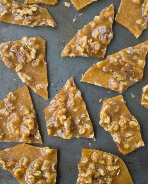 Perfect for gift giving or snacking on at parties, this Walnut Brittle with Cinnamon and Cloves is easy to make and so flavorful thanks to toasted walnuts and warm spices.  I’m partnering with California Walnuts to bring you a year of nutty and delicious walnut recipes. This post is sponsored by California Walnuts, but all opinions are my own. I'm a little obsessed with cloves right now. They're so warm and cozy and perfect for the holiday season. Ever since I tasted those coffee cooki Walnut Brittle, Fruity Pebbles Treats, Brittle Recipes, Walnut Recipes, Candy Recipes Homemade, Fruity Pebbles, Toasted Walnuts, Peanut Butter Recipes, Pudding Recipes