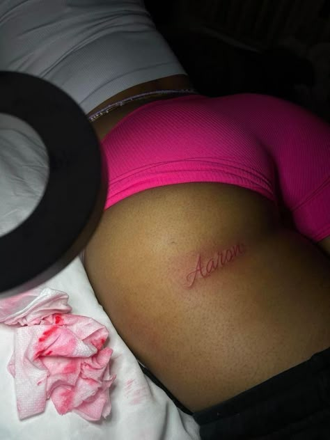 Tattoos On Buttocks For Black Women, Under Cheek Tattoos For Black Women, Buttcheek Tattoo Black Women, Hidden Name Tattoo Ideas For Women, Tattoo Ideas For Men For Girlfriend, Places To Get Boyfriend Name Tatted, Baddie Lower Back Tattoos, Name Tattoo Buttcheek, Name Tattoo Under Bum Cheek