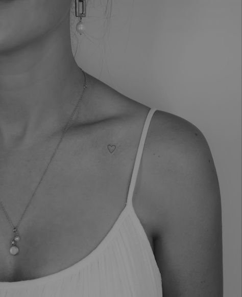 Heart Tattoo On Collar Bone Simple, Collar Bone Heart Tattoos For Women, Small Tattoos Clavicle, Open Heart Tattoo On Collar Bone, Initial Tattoo On Collar Bone, Collar Bone Minimalist Tattoo, Small Heart Tattoo On Neck, Colar Bone Heart Tattoo, Small Heart Collar Bone Tattoo