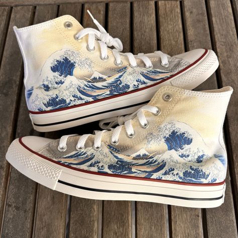 Custom Great Wave Converse Chuck Taylor High Top. These custom high top Converse featuring The Great Wave Off Kanagawa. This print is based off the original Japanese painting from 1830 by Katsushika Hokusai. We source each pair of shoes brand new directly from Converse. Each pair is made to order, please make sure you put in the correct shoe size before you check out. The ink is permanent and will never come off. Made in the USA. This price includes everything: shoes, artwork, and shipping. Thanks for stopping by our Etsy shop! Please message us with any questions! Sizes listed are in US sizing scale. Note: Blvd Custom is in no way affiliated with any of the shoe brands or companies that are featured on our website. Each pair of shoes is ordered lawfully bought at retail price. Cute Converse Shoes, Painted Converse, Girly Tingz, Chuck Taylor Shoes, Embroidered Converse, High Top Chucks, Womens High Top Shoes, Cute Converse, Converse High Top