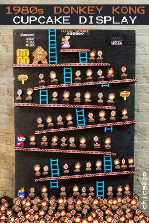 Display mini cupcakes on a board that looks like the classic Donkey Kong game. See how to make your own and get the free printable for making the cupcake picks. Classic Nintendo Birthday Party, Donkey Kong Cupcakes, Donkey Kong Party Decorations, Donkey Kong Decorations, Donkey Kong Birthday Party, Donkey Kong Party, Nintendo Birthday Party, Arcade Birthday Parties, Nintendo Party