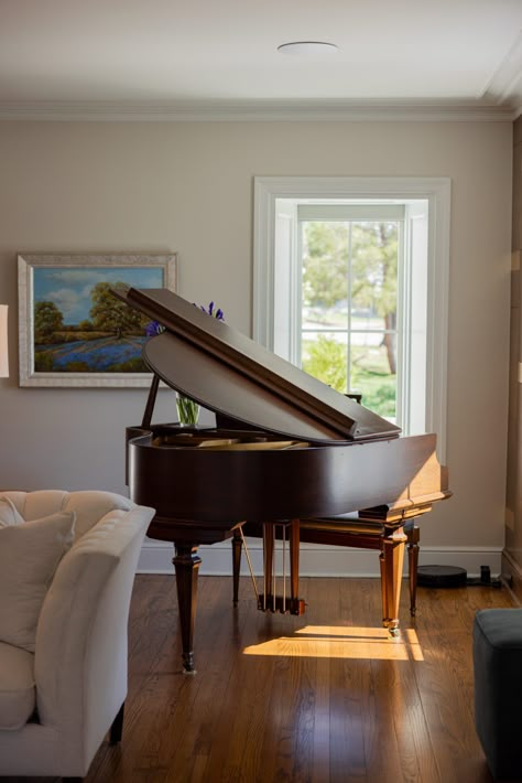 A baby grand piano is such an elegant piece to display in your living room.  1930s home renovation in Tulsa OK by Kirkendall Design #kirkendalldesign #tulsadesign #luxurydesign #interiordesign #babygrandpiano