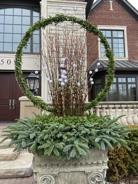 Lighted Steel Hoops | Dirt Simple Unusual Garden Ornaments, Deborah Silver, Winter Arrangements, Winter Planter, Winter Centerpieces, Garden Works, Christmas Planters, Garden Designer, Rope Lights