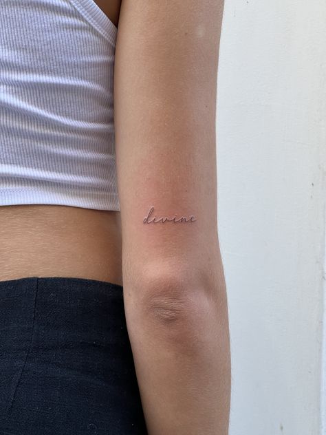 Dainty Cursive Tattoo Arm, Writing On Back Of Arm Tattoo, Small Word Tattoos For Women Arm, Back Arm Word Tattoo, Dainty Tattoos Writing, Dainty Feminine Tattoos Arm, Dainty Tattoo Words, The Word Delicate Tattoo, Fineline Tattoo Script