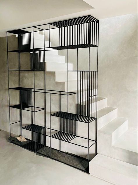 Metal Library Design, Black Metal Bookcase, Metal Shelves Living Room, Creative Bookshelves Modern, Display Unit Design, Black Modern Interior, Black Metal Shelves, Steel Bookcase, Staggered Shelves