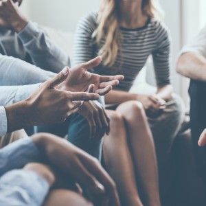 a group of people sitting in a circle, talking People Talking, Family Medicine, Learning And Development, People Talk, Psychology Facts, Support Group, Health Facts, Counseling, Marketing Strategy