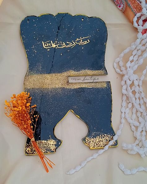 "Presenting our elegant handcrafted Quran Rehal, made with premium resin and adorned with golden details for a luxurious finish. Perfect for displaying the Quran with respect and style. 💛✨ A meaningful addition to your home or a thoughtful gift for loved ones. @resin_boutique__ DM us to place your order! 📩 #QuranRehal #ResinArt #HandcraftedWithLove #IslamicGifts #QuranStand #GiftIdeas" Rehal Quran, The Quran, Islamic Gifts, Resin Crafts, Resin Art, Thoughtful Gifts, Quran, First Love, Boutique