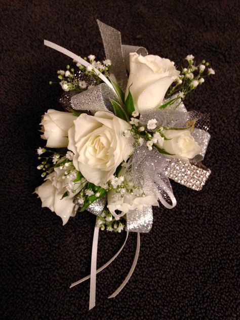 Wristlet corsage using a rhinestone wristlet. White spray roses and babies breath with silver and white ribbon and tulle accents. Floral design by Barbara Colson Wedding Coursage, Flowers At Wedding, Boutonniere Ideas, Wristlet Corsage, Prom Flowers Corsage, White Corsage, Prom Corsages, Wrist Corsage Prom, Prom Bouquet