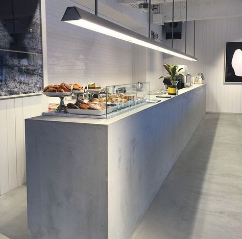 Saturdays Surf NYC / Open new store in Japan. Love the concrete counter Concrete Coffee Shop, Stone Reception Counter, Concrete Cafe, Bar Counter Design Home, Pastry Counter, Stone Reception, Vintage Living Room Design, Bar Design Home, Coffee Shop Counter