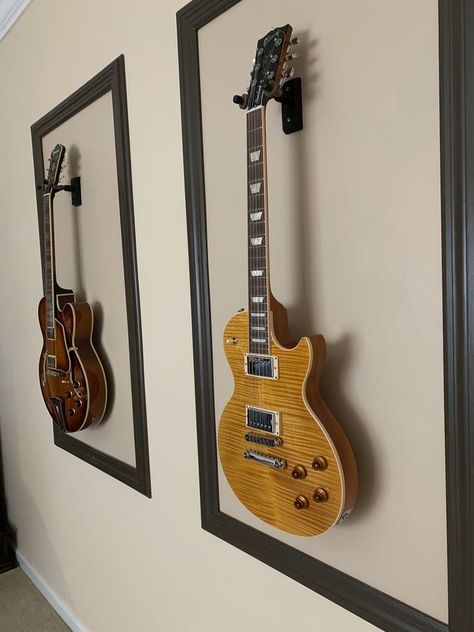 Wall Mounted Guitars, Wall Mounted Guitar Ideas, Framed Guitars On Wall, Guitar Mounted On Wall Decor, Guitar Mounted On Wall, Display Guitars On Wall, Guitar Wall Mount Ideas, Guitars On Wall Living Room, Guitar On Wall Decor