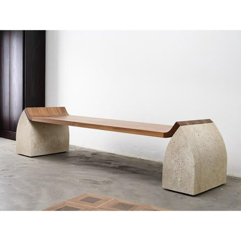 Traaf Bench Large by Tim Vranken Materials: American Walnut, Granito Stone Dimensions: L205 x W50 x H46 cm Tim Vranken is a Belgian furniture designer who focuses on solid, handmade furniture. Throughout his designs, the use of pure materials and honest, natural processes are paramount. The result is an unconcealed interplay of lines and shapes without the slightest frills. Tim’s collections are often characterized by pure, geometrical shapes in which junctions play a vital role or even become t Wood And Stone Bench, Modular Bench Seating, Brutalist Bench, Tire Bench, Organic Furniture Design, Rock Furniture, Concrete Bench Seat, Minimalist Bench, Wabi Sabi Furniture