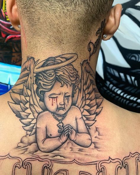 BIG NICK on Instagram: “Freehanded this baby angel anointed & prayed up 🙏🏾⚙️💉 . . . #tattoo #tattoos #realtattoo #creativeart #explorepage #ink #surrealism…” Hood Angel Tattoo, Angel Holding Money Bag Tattoo, Praying Angel Tattoo Designs, Baby Angel Tattoo For Men, Angel Praying Tattoo, Angel Face Tattoo, Praying Angel Tattoo, Angel Neck Tattoo, Ink Surrealism