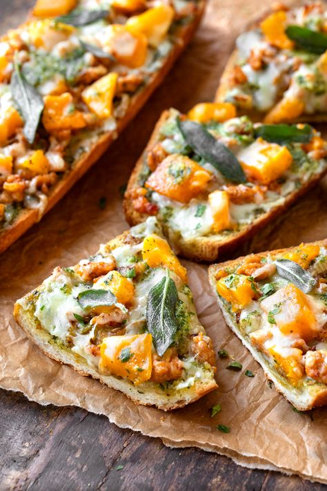 This butternut squash pizza is topped with roasted butternut squash, caramelized fennel and sweet sausage, plus a savory parsley-sage pesto! | thecozyapron.com #butternutsquashpizza #butternutsquashpizzasauce #butternutsquashpizzarecipe #butternutsquashpizzacrust #butternutsquashpizzabase #butternutsquashpizzacrusttoppings #parsleysagepesto Butternut Squash Pizza Sauce, Butternut Squash Pizza Recipe, Fennel Pizza, Caramelized Fennel, Sage Pesto, Butternut Squash Pizza, Squash Pizza, Roasted Fennel, Bread Pizza