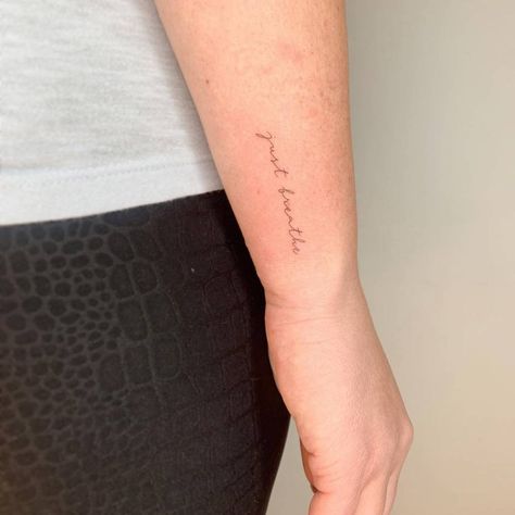 "Just breathe" lettering tattoo on the wrist Breath Wrist Tattoo, Breathe Wrist Tattoo, Just Breathe Tattoos For Women Wrist, Just Breathe Wrist Tattoos For Women, Just Breathe Tattoos, Breathe Fonts Tattoo, Just Breathe Tattoos For Women, Side Wrist Tattoo, Tattoo Just Breathe Fonts