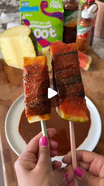 Samiya Jakubowicz on Instagram: "Watermelon + Pineapple-Mexican Snack Style 🔥 Had to make this again but tried pineapple too…  BANGERS 🕺🍉🍍  Sliced, wrapped in a fruit rollup, dipped in Chamoy, sprinkled with Tajin.  Its so JUICY, sweet, spicy, sour  My summer guilty pleasure   #watermelon🍉 #pineapples #mexicansnacks #chamoy #tajín #mexicanfruit #summersnacks #fruitrollup #chamoydip #fruitsnack" Watermelon Wrapped In Fruit Roll Up, Watermelon Fruit Roll Up Chamoy, Chamoy And Tajin Fruit, Chamoy Recipe Ideas, Pineapple Tajin, Watermelon Tajin, Watermelon Chamoy, Mexican Watermelon, Watermelon Snack