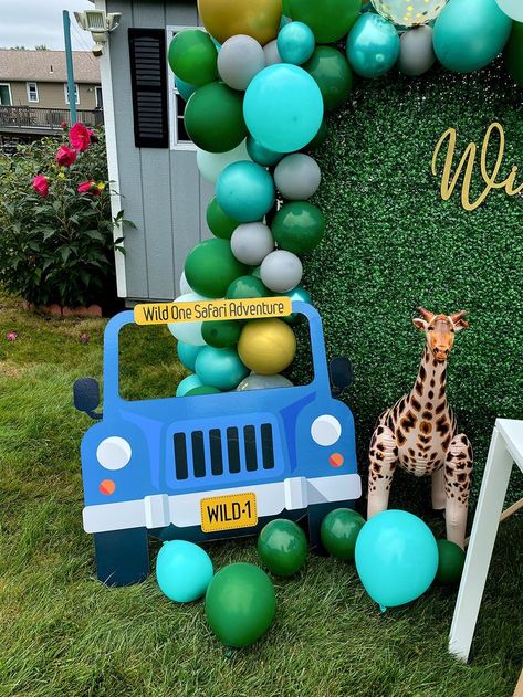 Wild One Theme, First Birthday Party, Safari Animals, Green Hedge Wall, Photo Backdrop, Balloon Arch, Wild Animals, Giraffe, Animal Cupcakes, 1st Birthday Theme, One Year Old Birthday Party, Jeep Photo Prop Wild One Backdrop Ideas, Wild One Photo Backdrop, Safari Photo Backdrop, Wild One Photo Board, Cupcakes 1st Birthday, Safari 1st Birthday Backdrop, Green Hedge Wall, Safari Birthday Theme, Wild One Safari Birthday