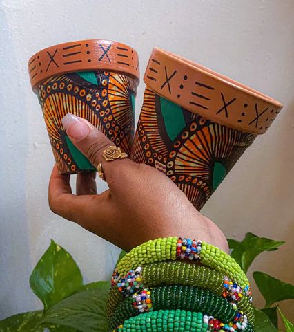 9 Spring DIY African Fabric Craft Ideas For the Home – Reflektion Design Snug Ideas, Afrocentric Home, Craft Ideas For The Home, Afrocentric Decor, Fabric Decoupage, Clay Planter, African Gifts, Diy Fabric Crafts, African Crafts