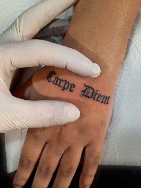 Carpe Firm Tattoo, Tattoo Ideas For Men Small Arm, Side Of Hand Tattoo Men, Carp Diem Tattoo, Carpe Diem Tattoo Men, Word Tattoos Men, Carpe Diem Tattoo Fonts, Watch Over Me Tattoo, Text Tattoo Men