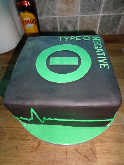 Type O Negative cake - This cake was made for my partner, he is a big  Type O Negative fan, they are a Heavy metal, goth band. So i thought id do there signature symbol and keep it simple. Thank for looking! Metal Birthday Cake, Type O Negative Band, Cake Music, Type 0 Negative, Skull Emoji, Metal Goth, Simple Thank, Goth Bands, Peter Steele