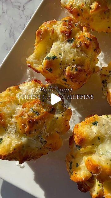 Eating Micheline🍋🥐🌮 on Instagram: "cheesy garlic bread muffins I pull-apart style with garlic butter, mozzarella & parsley. Perfect little appetizer or snack🧀😋

Recipe (makes 6 large muffins)
•dice one can of homestyle biscuit dough into
small pieces
•add to a bowl with 1/4 cup chopped parsley
•add 3tbsp melted butter with 1tbsp minced garlic
•dice 4-5 mozzarella cheese sticks & add to bowl
•gently mix it all together
•form into balls and place in cupcake pan
•bake at 375 for 15 minutes

made by shewillevolve💗💗

#cheesybread #garlicbread #easyrecipes
#snackideas #easysnack #appetizers
#appetizerideas #quickrecipes #biscuits
#recipeshare #recipeoftheday" Cheesy Garlic Bread Muffins, Garlic Muffins, Garlic Bread Muffins, Large Muffins, Mozzarella Cheese Sticks, Garlic Seasoning, Cheesy Garlic Bread, Biscuit Dough, String Cheese