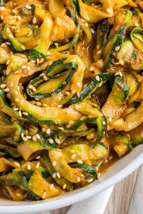 This paleo Chinese Zucchini is refreshing, nutty, spicy, and will leave you wanting more! You’ll love this as an addictive side dish, or add your favourite protein to make it a main meal. The crunch of the courgettes is refreshing, and the spices and herbs add a complex flavour. These raw, paleo, Whole30 compliant Raw Spicy Zoodles are uncooked, giving you the optimum nutrition from each ingredient. Chinese Zucchini, Zucchini Noodle Recipe, Zucchini Noodle, Zucchini Noodle Recipes, Zoodle Recipes, Zucchini Recipe, Vegan Zucchini, Healthy Summer Recipes, Optimum Nutrition