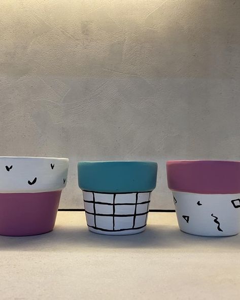 Playful and colorful! 💕💙 This pastel mini clay pot set is perfect for adding a pop of personality to your home or office. Hand-painted with unique designs, they're ready to brighten up any corner of your life! 🌸🌿 #ColorfulDecor #PastelLovers #MiniClayPots #CreativeSpaces #MinimalistDecor #BlackAndWhiteAesthetic #PlantLovers #StylishSpaces #EmonGardening #Pots #IndoorDecor #Emon #Gardening #Decor #DecorInspo #MiniClayPots #HomeDecor #IndoorPlants #GardenDecor #PlantLovers #BrightenYourSpace ... Pot Clay Art, Flower Pots Ideas, Pots Ideas, Pastel Mini, Gardening Decor, Mini Clay, Painted Flower Pots, Pot Set, Black And White Aesthetic