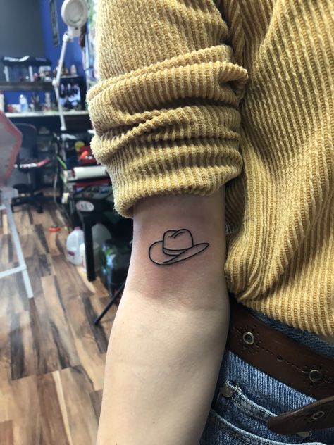 my lil cowboy hat Country Hat Tattoo, Simple Cowboy Hat Tattoo, Small Cowboy Hat Tattoo, Tattoo Cowboy Hat, Country Tattoo Ideas, Western Tattoo Ideas, Country Tattoo, Cowboy Boot Tattoo, Cowboy Hat Tattoo