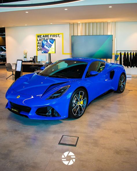 Lotus Emira ∆ . The Lotus Emira is a mid-engined sports car that represents the culmination of Lotus's engineering legacy, succeeding the Elise, Exige, and Evora. Launched in 2021, it features a lightweight aluminum chassis and is powered by either a supercharged 3.5-liter V6 or a turbocharged 2.0-liter four-cylinder engine, delivering up to 360 horsepower. The Emira is designed for everyday usability, combining striking aesthetics with advanced technology, including a 10.25-inch touchscreen ... Lotus Emira, Lotus Evora, The Lotus, Sports Photography, Sound System, Advanced Technology, Sports Cars, Phone Wallpaper, Lotus