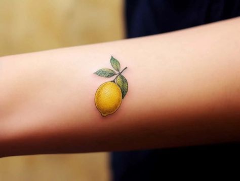 Lemon Tattoo Meaning: An Exploration of Symbolism and Designs Lemon Tattoo Realistic, Italian Lemon Tattoo, Lemon Tattoo Design, Lemon Tattoo Minimalist, Small Lemon Tattoo, Food Tattoo Ideas, Fruit Tattoos, Secret Tattoo Ideas, Lemon Tattoo