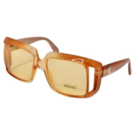 How stunning are these Versace dead stock sunglasses circa 1990s?! The perfect square frame sunglasses in a vibrant and stunning gradient orange color-way. These are the perfect every day sunglasses with a vibrant flare! Match these to a multicolor Pucci dress and pair with a Moschino handbag for a playful and laid back look. Never been worn, new dead stock sunglasses in perfect condition, please see photos. Made in Italy. 90s Glasses, Glasses Fashion Eyewear, Glasses Frames Trendy, Pucci Dress, Orange Sunglasses, Square Frame Sunglasses, Stylish Glasses, Versace Sunglasses, Jewelry Lookbook