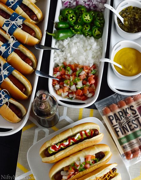 An Easy Hot Dog Bar Idea for a Grilling Party – Nifty Mom Ball Park Food Ideas For Party, Birthday Hot Dog Bar, Ball Park Food Ideas, Hot Dog Party Food, Hamburger And Hotdogs Party, Hot Dog Display For Party, Hot Dog And Brat Bar, Burger And Hot Dog Bar Party Ideas, Hamburger Hot Dog Party