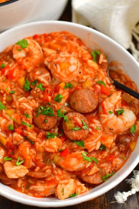 Jambalaya is a classic spicy New Orleans dish loaded with sausage, chicken, and shrimp. This hearty and meaty dish is made in one pot with rice, the holy trinity of vegetables, Cajun spices, hot sauce, and tomato broth. #jambalaya #rice #dinner #chicken #sausage #andouille #shrimp #onepot #creole #cajun Ham Dinners, Jambalaya Rice, Shrimp Jambalaya, Cajun Spices, Jambalaya Recipe Easy, Searing Meat, Jambalaya Recipe, Tomato Broth, Rice Dinner