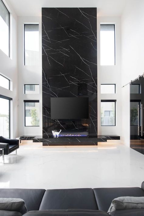 Black And White Chimney, Black Marble Fireplace Wall, Black Marble Tile Fireplace, Two Storey Fireplace, Dark Fireplaces, Lakehouse Fireplace, Fancy Fireplace, Black Marble Fireplace, Modern Fireplace Ideas Living Rooms