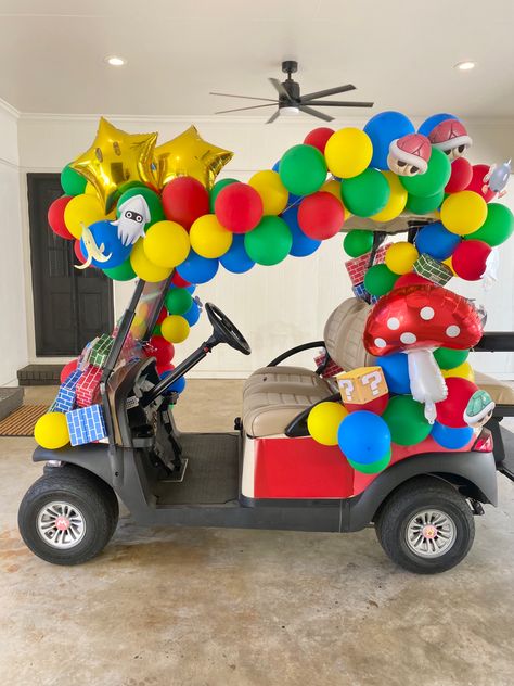 This year we wanted to make the golf cart the center of the show! Clicking the photo will take you to a quick tutorial video. In the video description are the unique items used to create the look! Mario Kart Golf Cart, Circus Golf Cart, Mario Kart Golf Cart Decor, Super Mario Golf Cart, Halloween Golfcart Ideas, Diy Halloween Golf Cart Decorations, Mario Golf Cart Decorations, Golf Cart Halloween Decorations, Golf Cart Trunk Or Treat Ideas